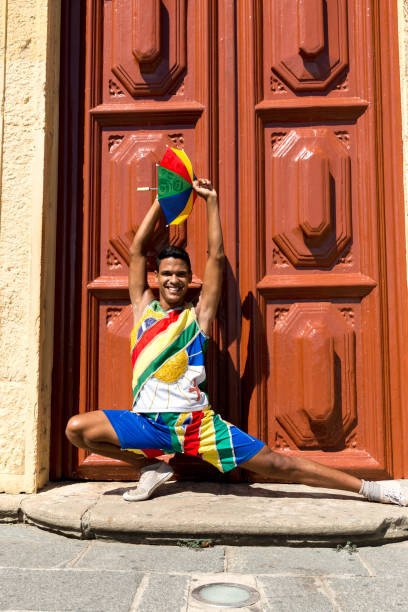 istock Young Brazilian guy dancing Frevo in Olinda, Brazil 817442814