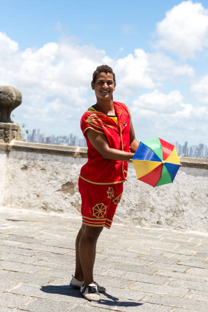 istock Young Brazilian guy dancing Frevo in Olinda, Brazil 817445978