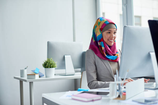 istock Busy Muslim woman at computer 817450480