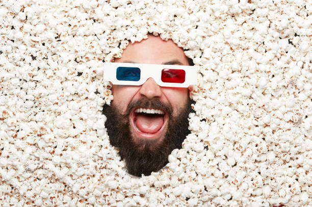 istock Shouting man in popcorn and glasses 817456480