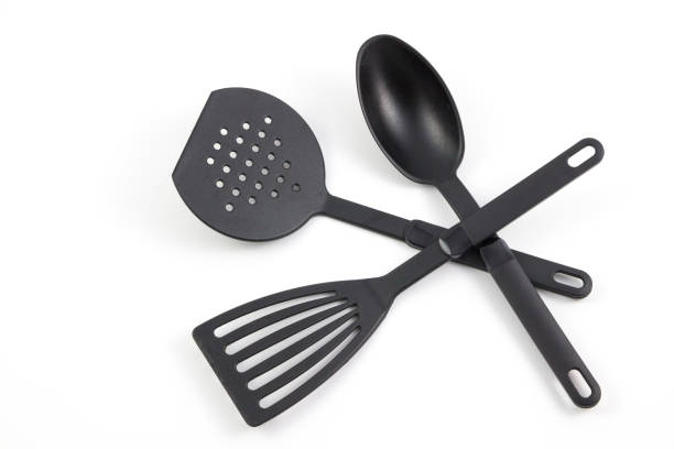 istock black plastic kitchen set skimmer, spade of frying pan isolate white background, 817465950