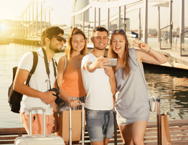 istock Happy friends travellers smiling and making selfie 817466470