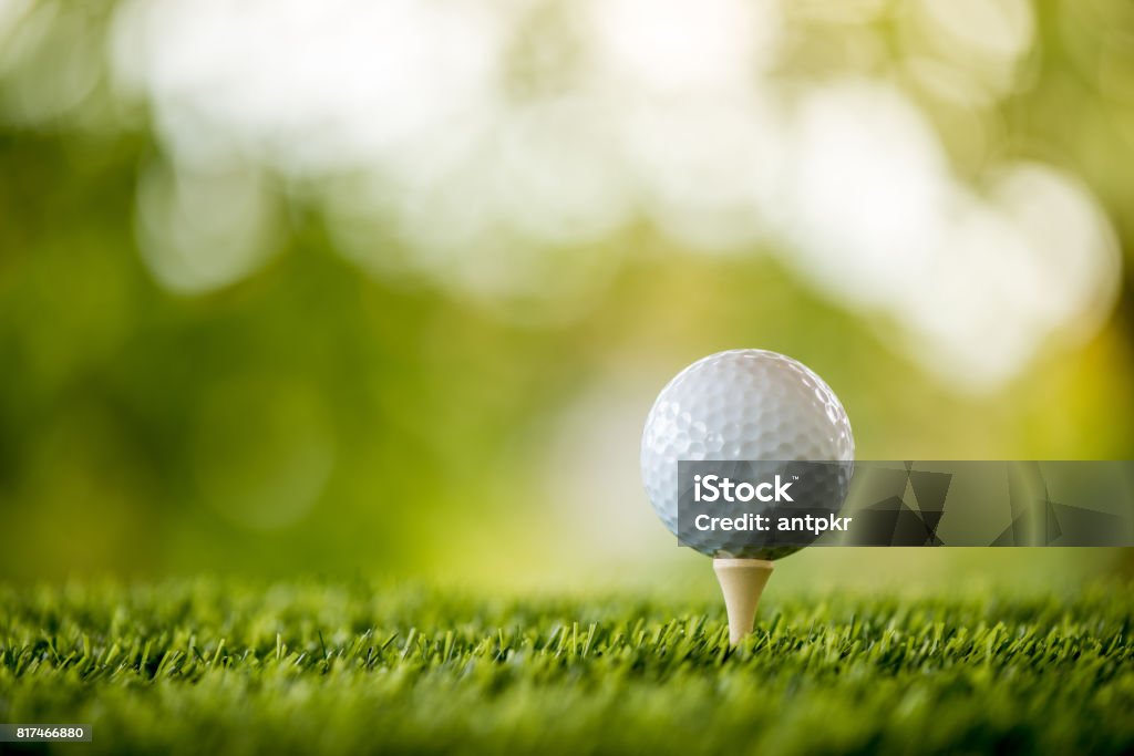 golf ball on tee ready to play Golf Ball Stock Photo