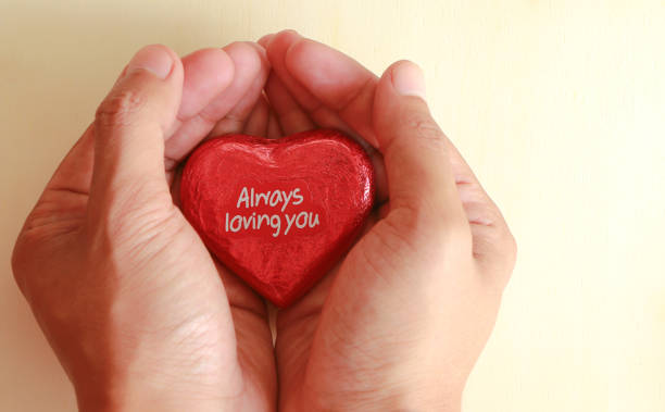 istock Male hand holding chocolate heart 817472238