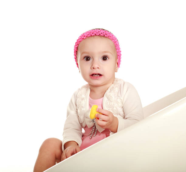 istock Surprised little baby on white background looking 817472296