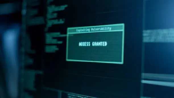 Photo of Display Showing Stages of Hacking in Progress: Exploiting Vulnerability, Executing and Granted Access.
