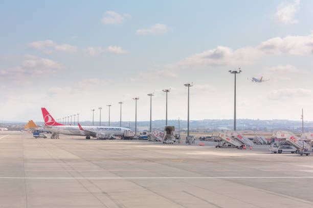 Airplanes and Turkish Ground Services vehicles in Sahiba Gokcen Airport, Istanbul, Turkey stock photo