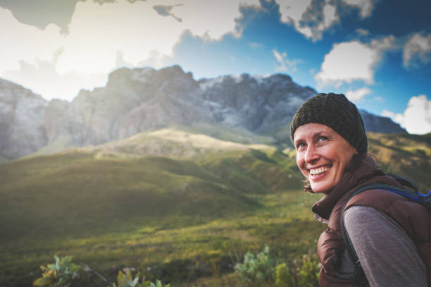 istock Happy Female Hiker Looking Over her Shoulder 817513466