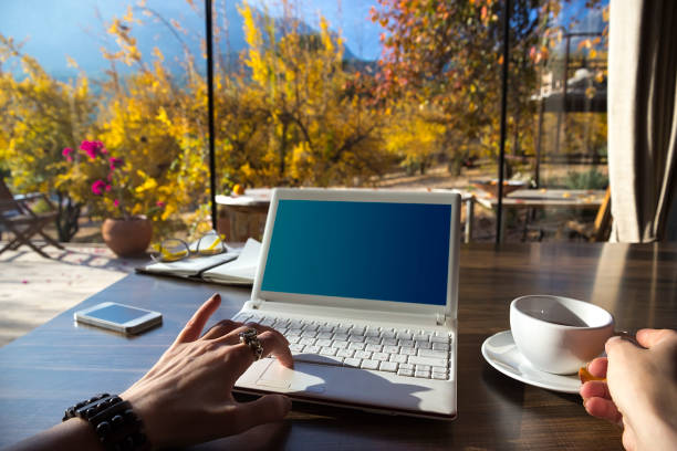 istock Workspace with laptop, girl's hands, notebook, sketchbook, glasses 817514694