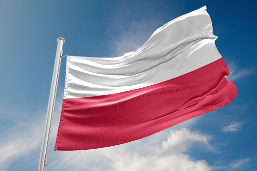 Poland flag is waving at a beautiful and peaceful sky in day time while sun is shining. 3D Rendering
