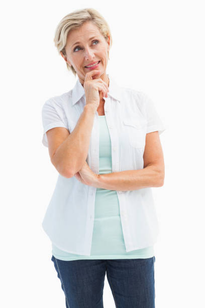istock Happy mature blonde thinking with hand on chin 817517484