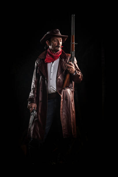 istock American cowboy with guns 817538466