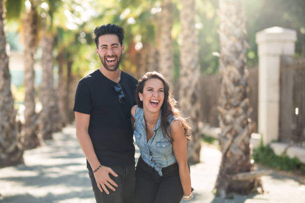 istock Happy couple standing together outside having fun 817539042