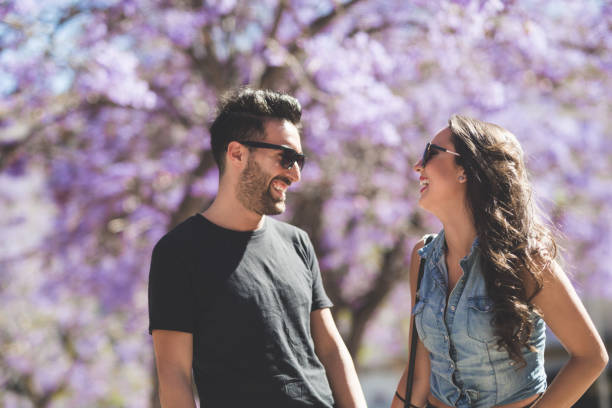 istock Happy couple standing outside laughing 817543984