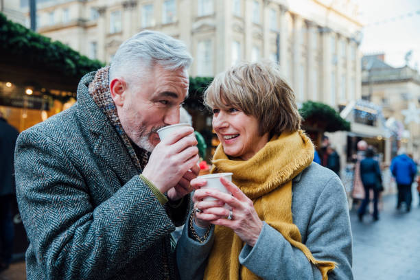 istock Enjoying Coffee At The Christmas Market 817551830