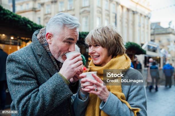 Enjoying Coffee At The Christmas Market Stock Photo - Download Image Now - Christmas Market, Winter, Couple - Relationship