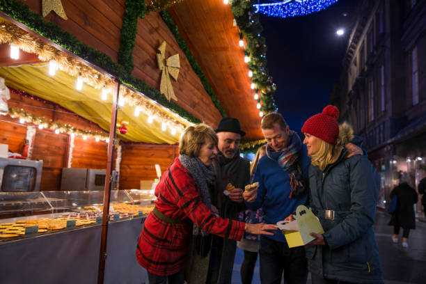 istock Sharing Waffles At The Christmas Market 817552376