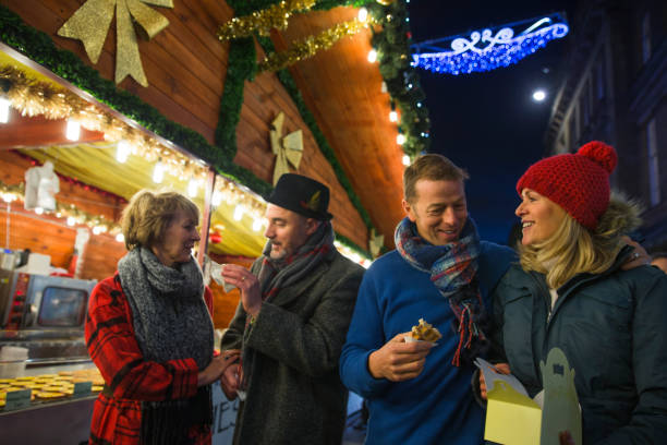 istock Eating Waffles At The Christmas Market 817552388