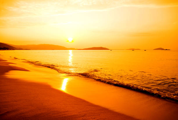 Aerial view wide shot beautiful sunset tropical beach sea in south thailand Asia