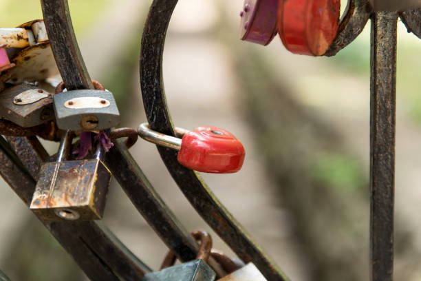 istock Padlock in combination with ropes, threads and scraps of fabric. 817560248