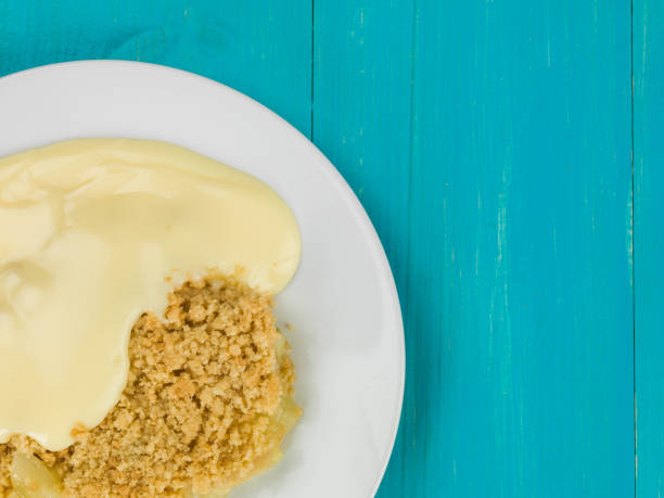 istock Apple Crumble Sweet Dessert Served With Hot Custard 817584566