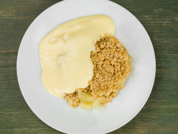 istock Apple Crumble Dessert Served With Hot Custard 817584572