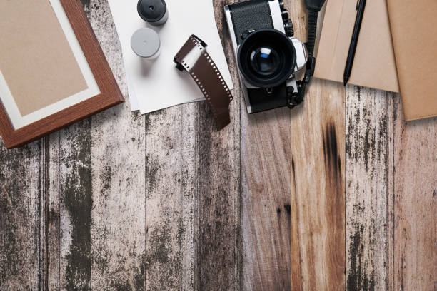 istock Camera and supplies, Blank photo frames on wood 817588088