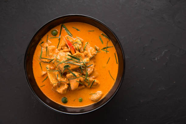 istock Thai style Red curry with Beef menu or Thai name is panaeng neur. Beef menu with coconut milk.Panaeng Curry with Pork on Wooden table 817588410