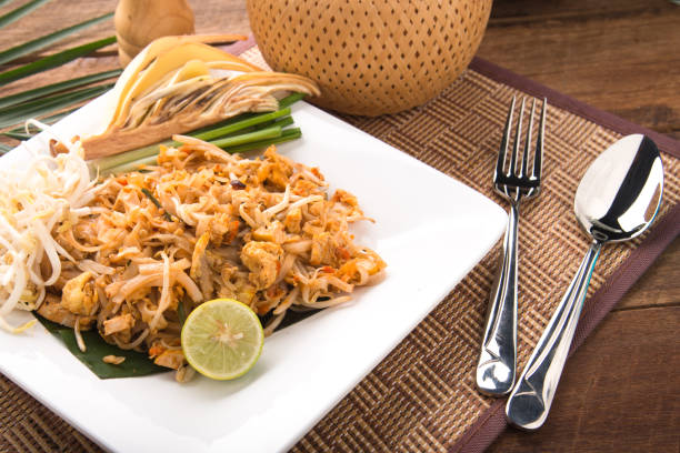 Thai Fried Noodles Pad Thai with shrimps or prawns.street food. fried noodles with chicken and shrimp Thai Fried Noodles Pad Thai with shrimps or prawns.street food. fried noodles with chicken and shrimp beef pad stock pictures, royalty-free photos & images