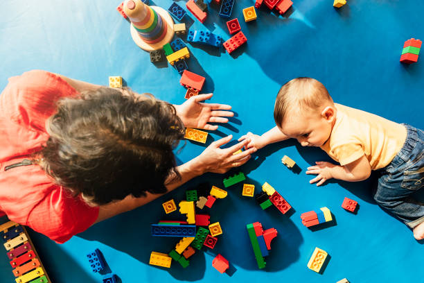 istock Child boy and mother playing. 817588528