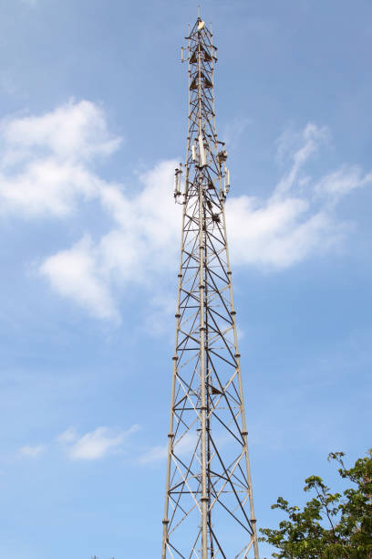 istock Mobile phone communication tower transmission signal with blue sky and antenna 817649528