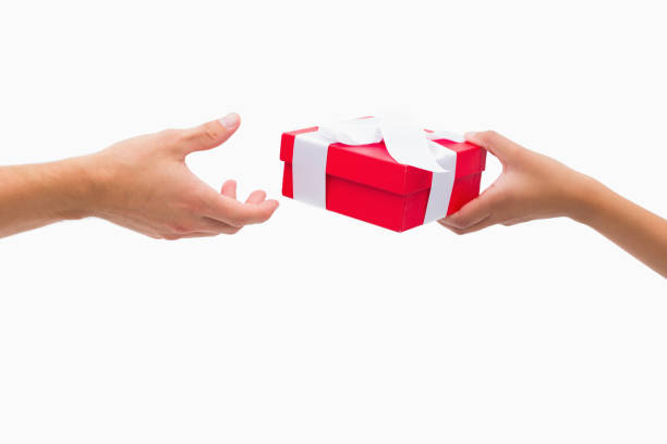 istock Woman passing man a gift 817656110