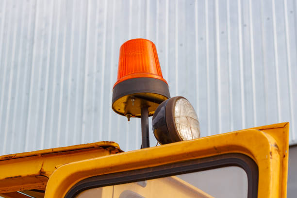 istock Orange flashing beacon on a forklift truck closeup 817659674