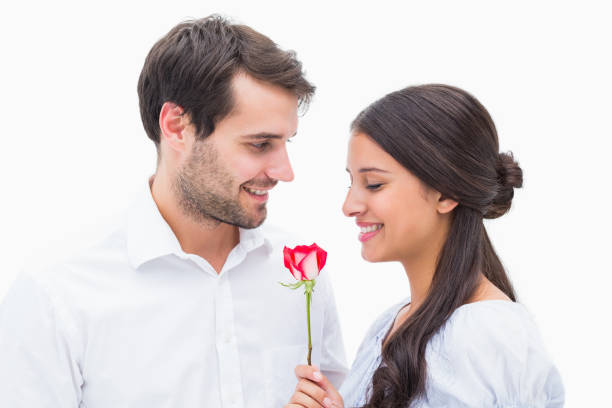 istock Handsome man offering his girlfriend a rose 817663526