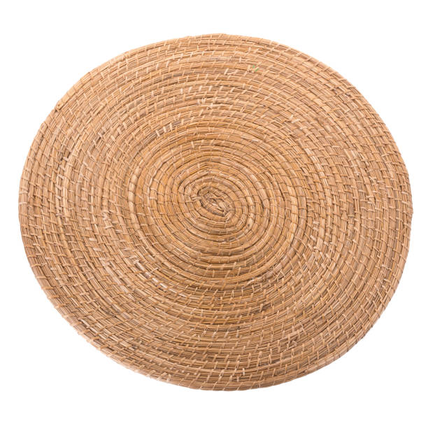 istock golden  round wicker mat on white background 817673814