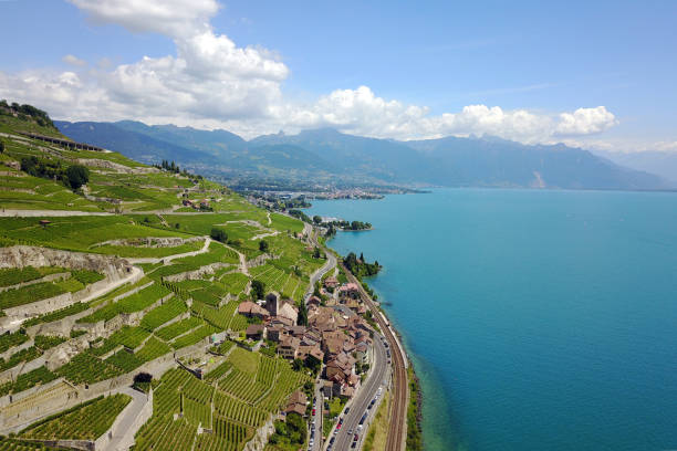 Lavaux, Switzerland Aerial image of Lavaux vineyards in Switzerland featuring the charming village of Saint Saphorin. montreux photos stock pictures, royalty-free photos & images