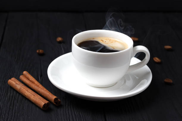 istock Hot coffee with foam in a white cup with cinnamon 817677606