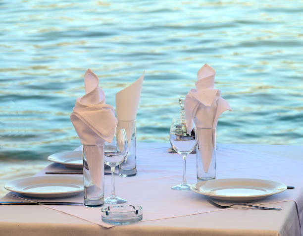 istock Table in the restaurant on the seaside, arranged for lunch 817690306