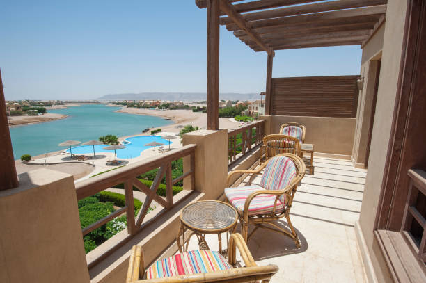 istock Terrace balcony with chairs in tropical luxury apartment 817710952