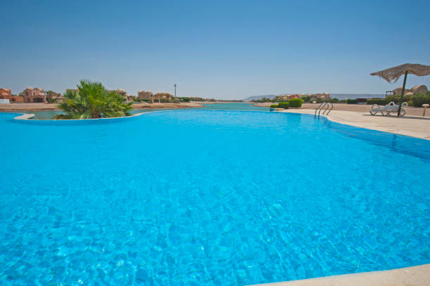 istock Swimming pool at at luxury tropical holiday villa 817711146