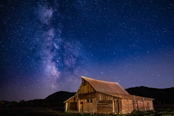Milky Way Over Morman Row Milky way above T. A. Moulton’s barn along Morman Row in Grand Teton National Park mormonism photos stock pictures, royalty-free photos & images