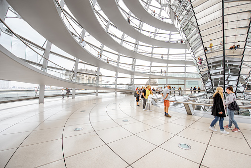 BERLIN, GERMANY - July 06, 2017: Interior view of famous Reichstag Dome with people in Berlin, Germany. It is one of Berlin's most important landmarks