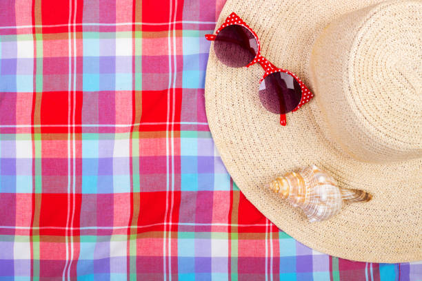 istock Straw Beach Woman's Hat Sun Glasses Top View Seashell with space for text. 817766594