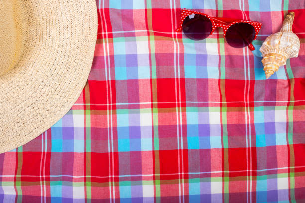 istock Straw Beach Woman's Hat Sun Glasses Top View Seashell with space for text. 817766608