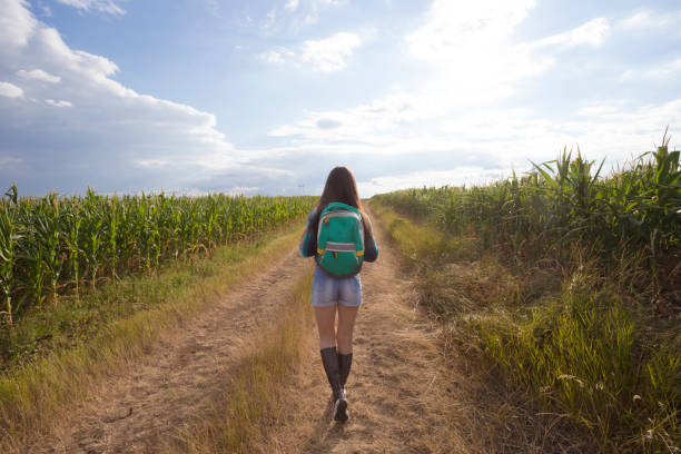 Long hair brunette girl hiking outdoors. Photo is taken with dslr camera.