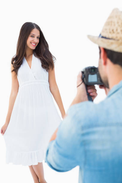 istock Hipster taking a photo of pretty girlfriend 817781652