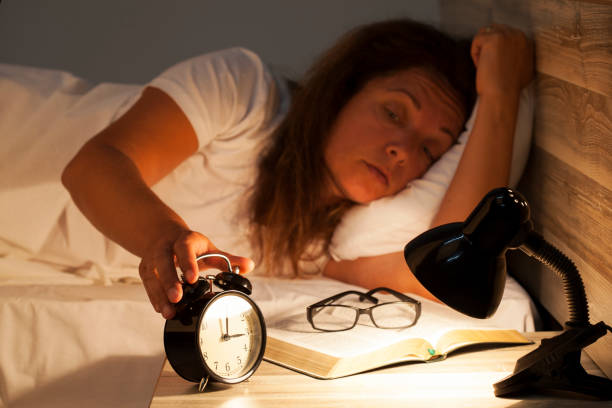 istock Woman lying in bed suffering from insomnia 817791718