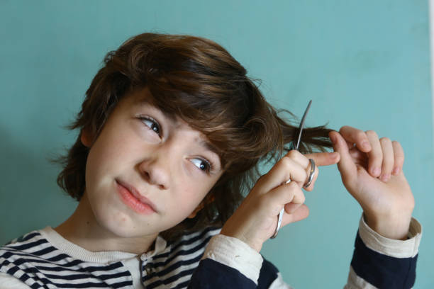 Teenager Boy Cut His Hair With Scissors Stock Photo - Download Image Now - Boys, Child, Cutting Hair - iStock Teenager Boy Cut His Hair With Scissors Stock Photo - Download Image Now - Boys, Child, Cutting Hair - iStock