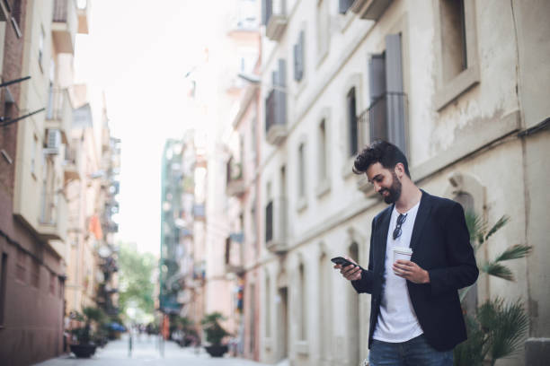 istock Young man checking messages on the phone 817831336