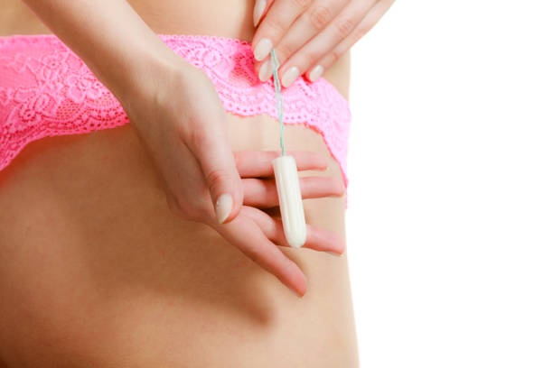 istock Woman with tampon in monthly cycle. 817831978
